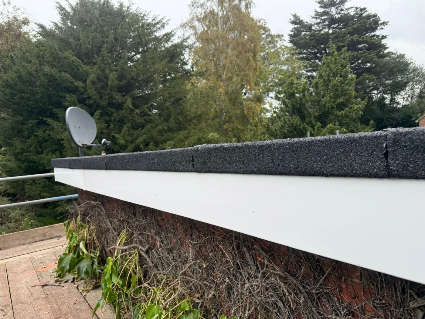 New felt flat roof with neat drip edge and UPVC fascia on a Portsmouth garage extension
