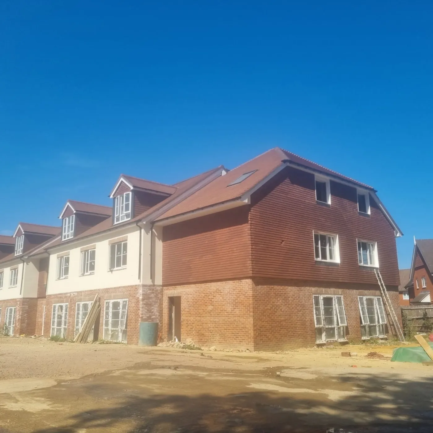 Completed commercial-scale clay tile roof on a new-build residential development in Portsmouth