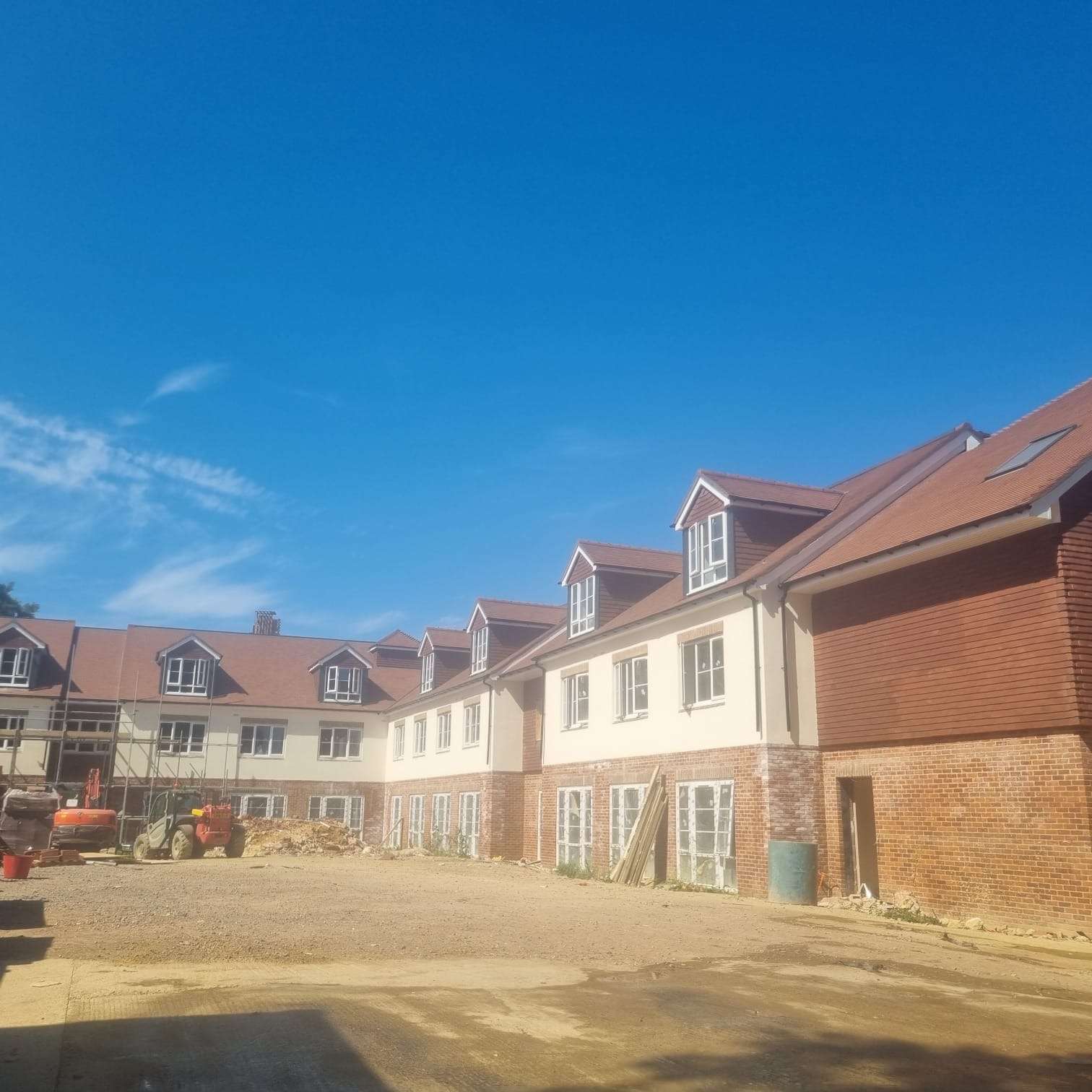 Completed clay tile re-roofing on a large new-build residential development in Hampshire by CJH Roofing