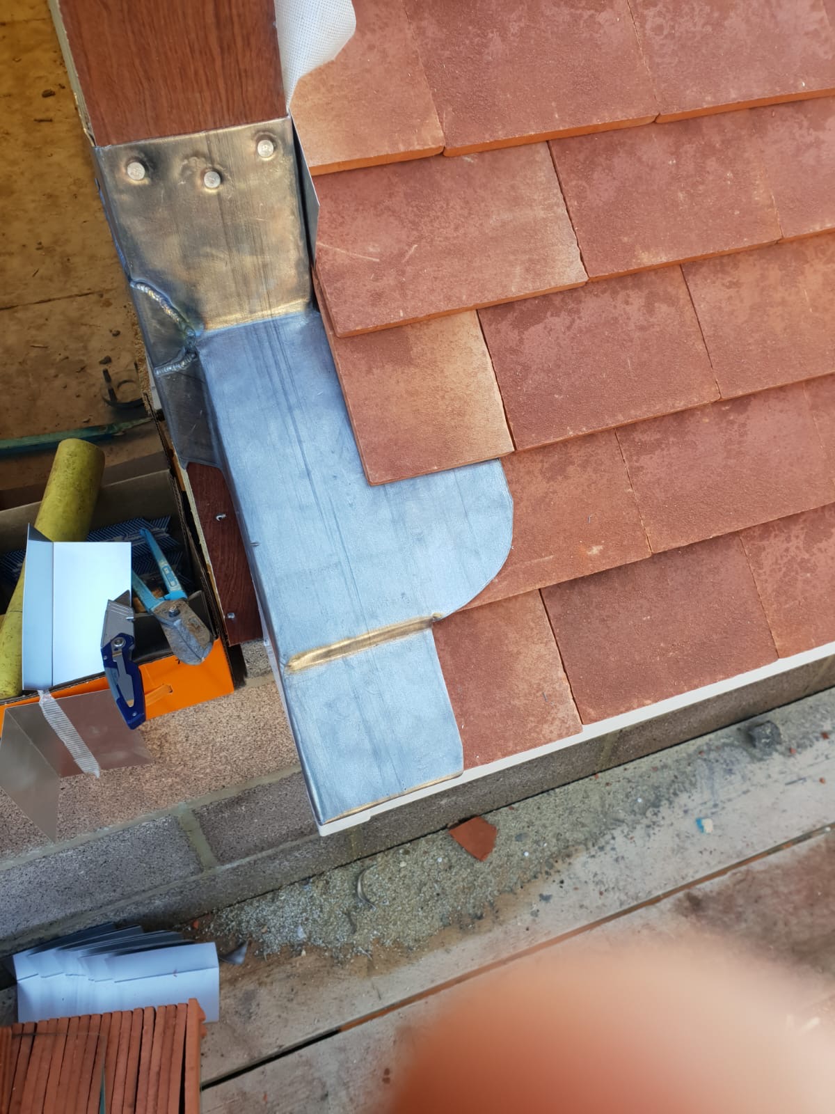 Lead valley and welded gulley detail dressed against new clay roof tiles on a Portsmouth re-roof
